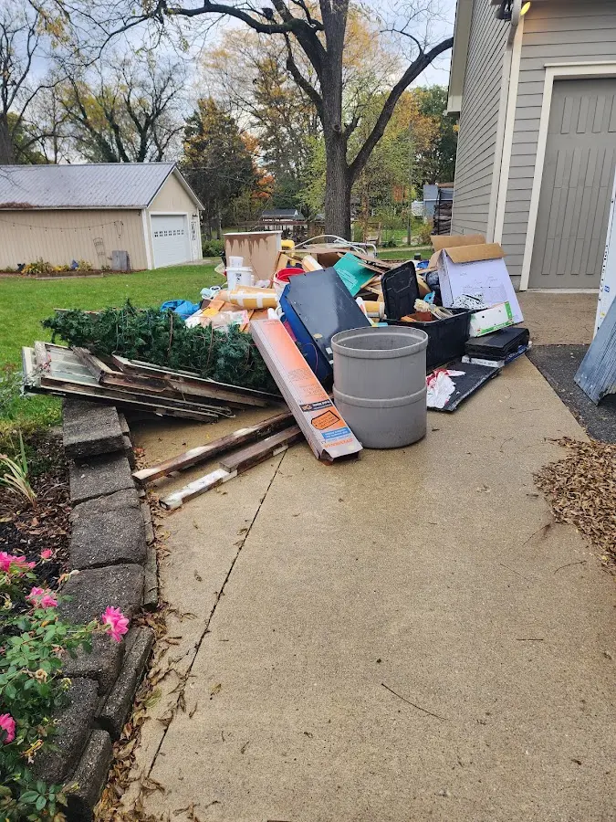 Dumpster being loaded with debris for Residential Dumpster Rental in Macclenny
